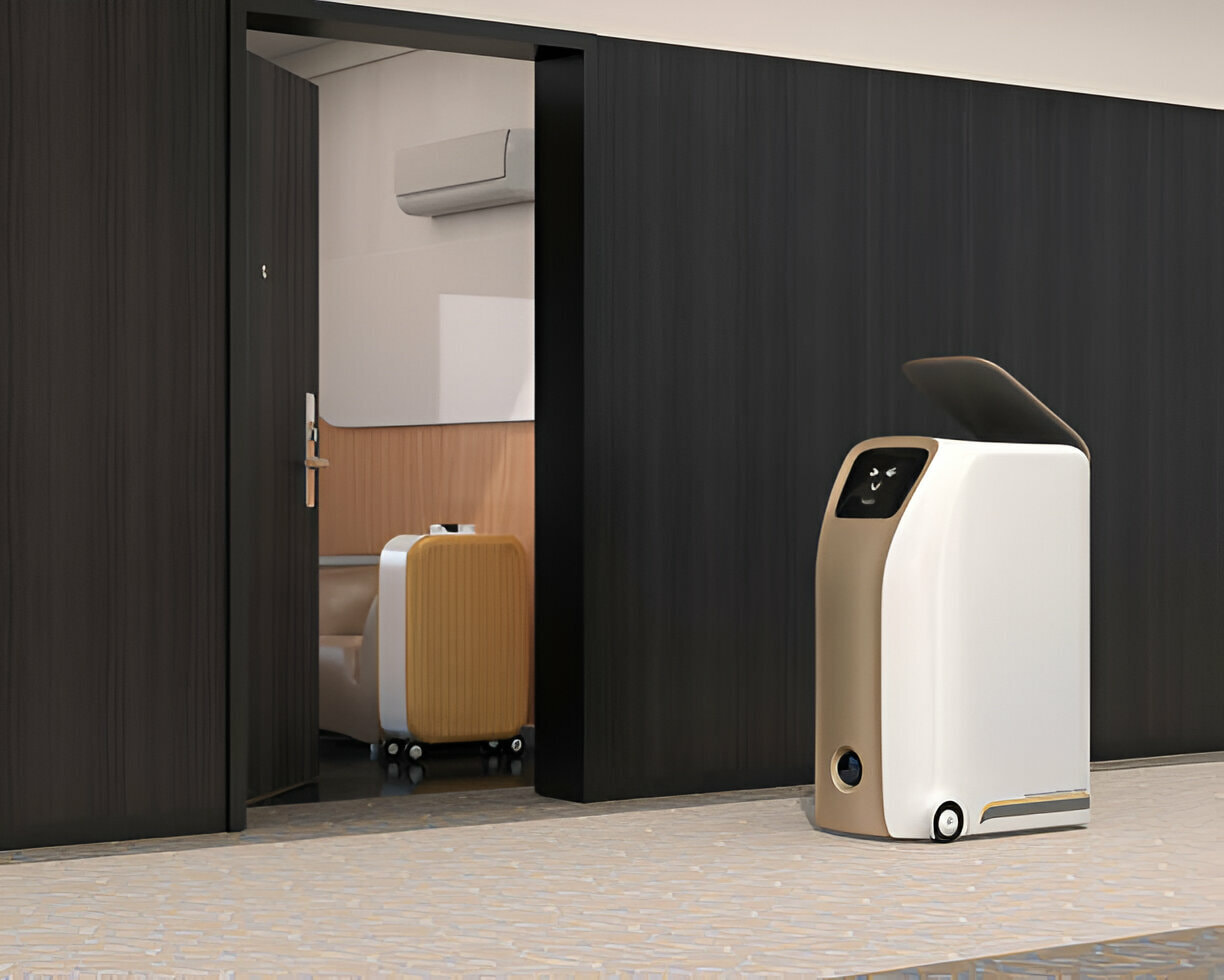 A delivery robot waiting in front of a hotel door.