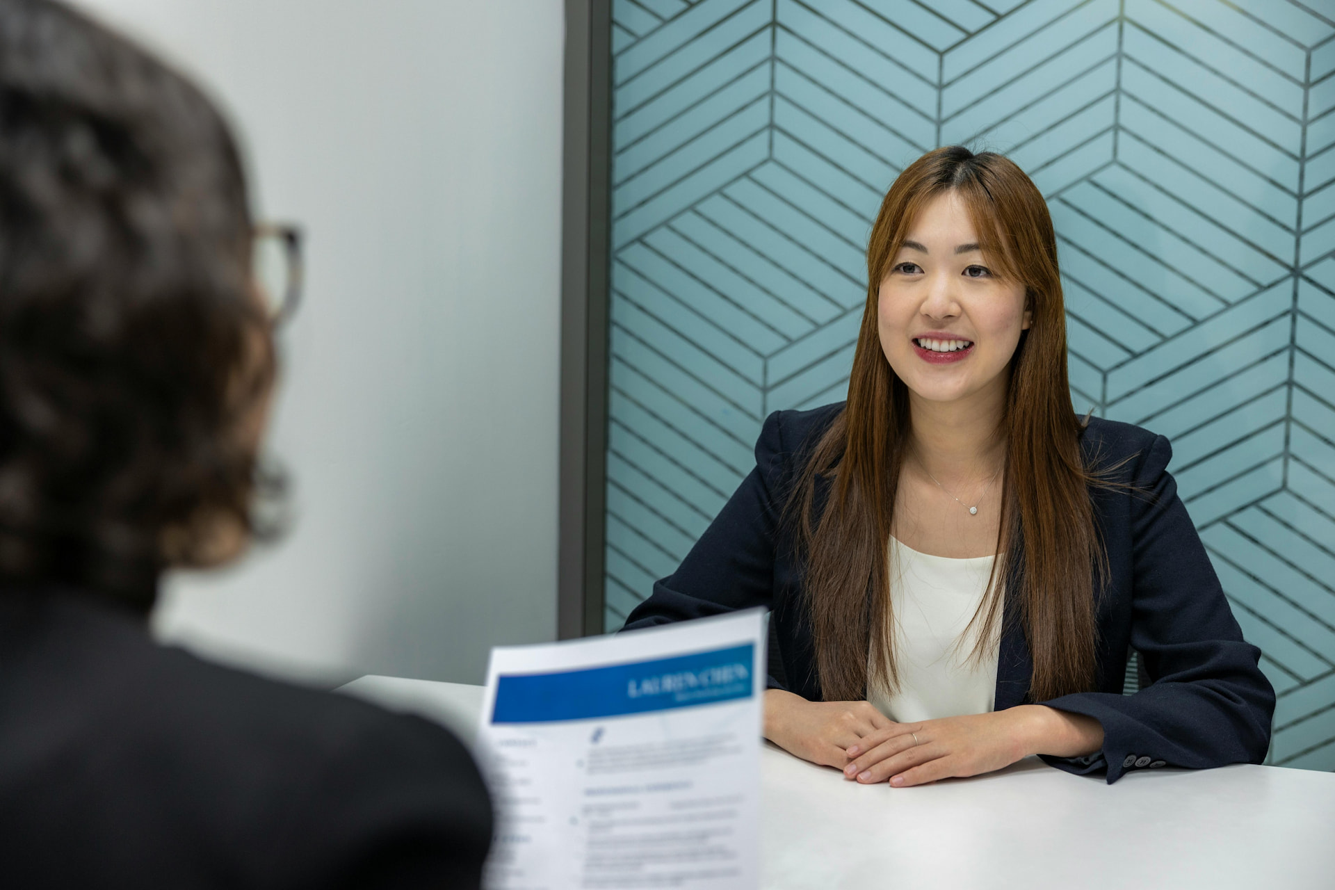 A female being interviews by another female.